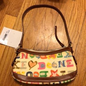 Dooney & Bourke mini top zip purse never been used